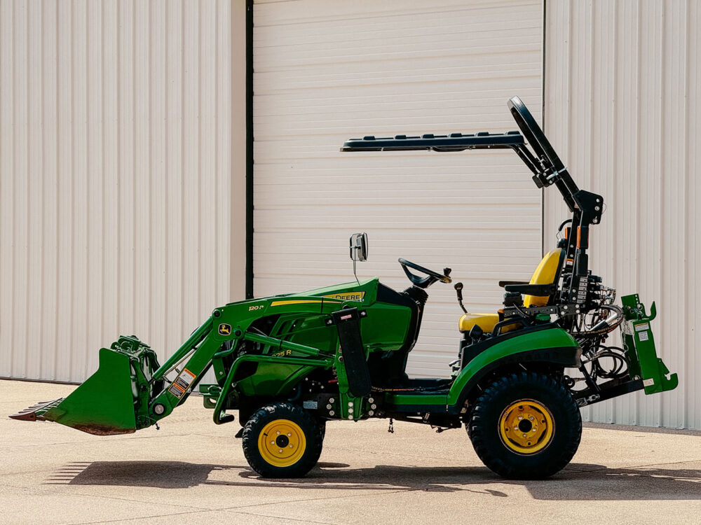Side View of Rhinohide Canopy on John Deere 1025R with Angled Roll Bar