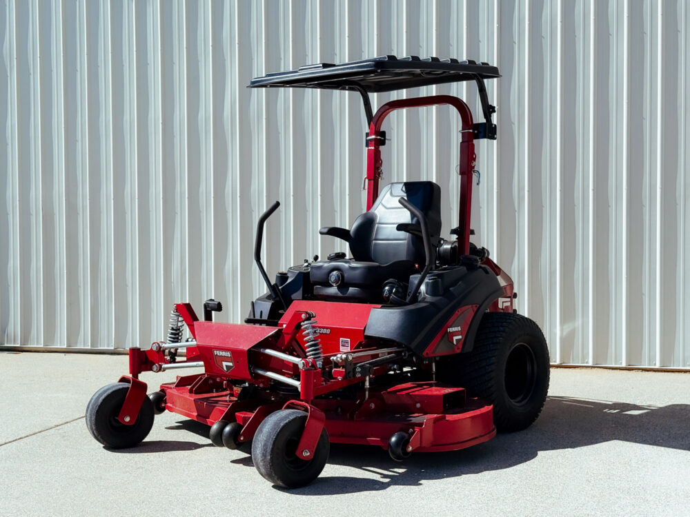 a shade canopy mounted to the roll bar of a zero turn mower
