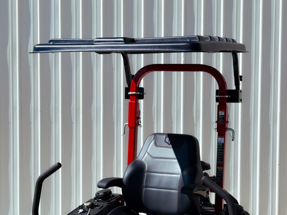 black plastic shade canopy mounted to zero turn roll bar
