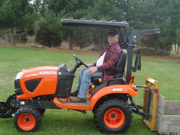 Rhinohide Canopy Mounted Below ROPS Hinge on Kubota BX2380 Tractor